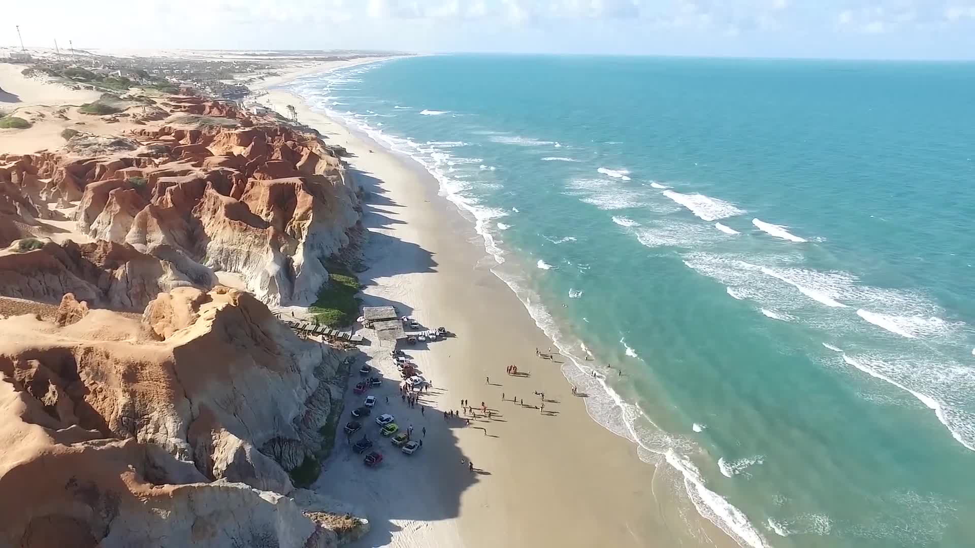 Ocean waves meeting a sandy beach